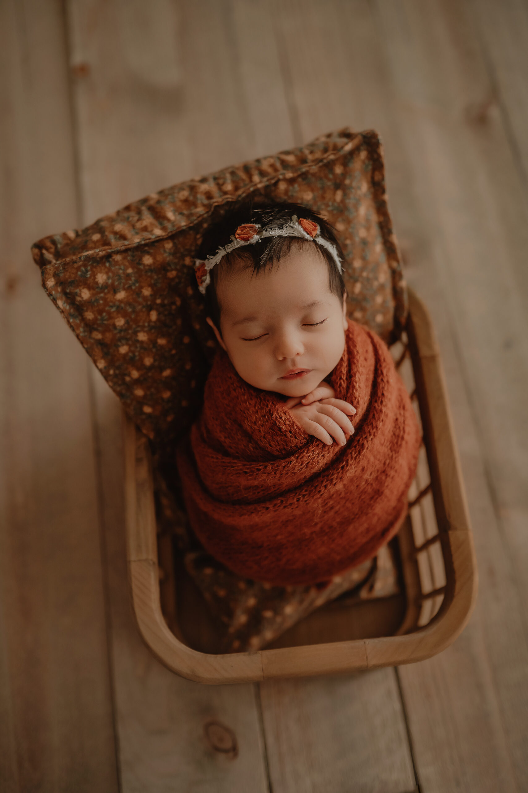 baby girl wrapped in a basket in york pa newborn photography studio